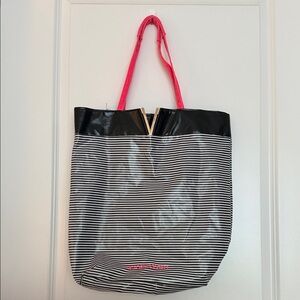 Victoria’s Secret black-and-white striped nylon bag with hot pink handles.
